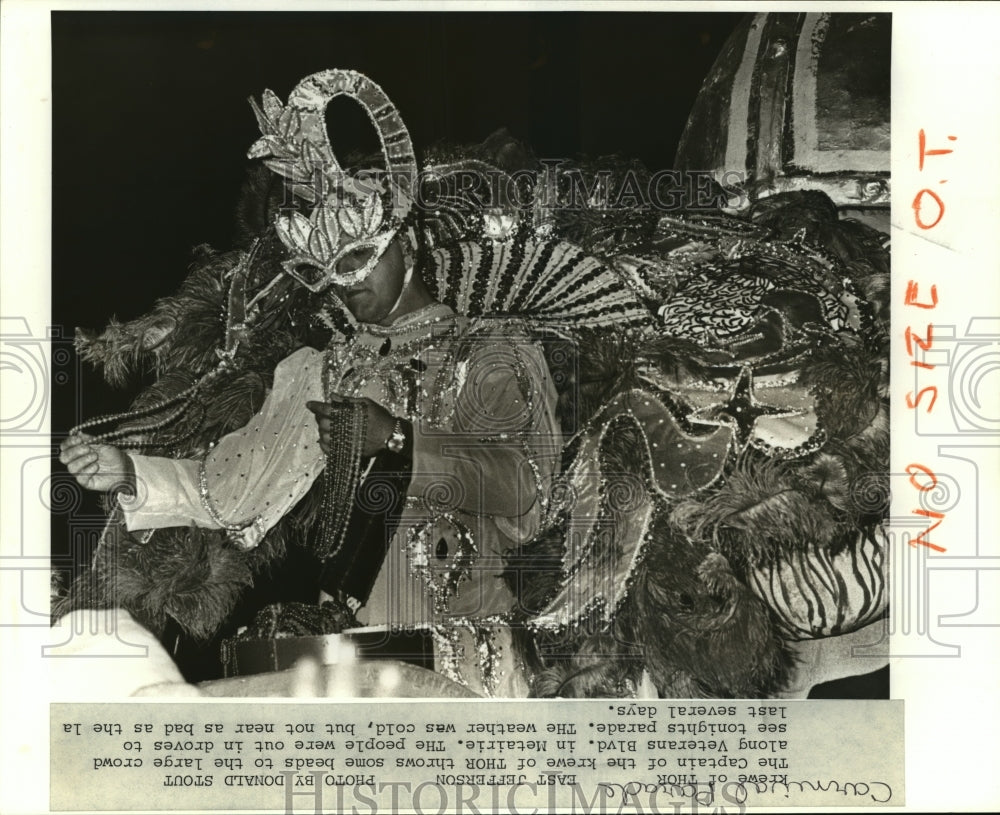 1988 Captain of Krewe of Thor Throws Beads in Parade at Mardi Gras - Historic Images