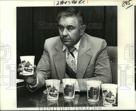 1980 Krewe of Alla Member Shows New Cup Given as Mardi Gras Throw - Historic Images