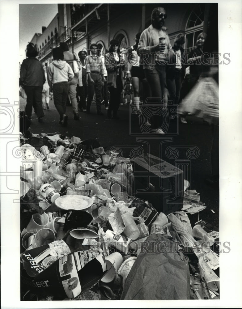 1987 Trash lines the French Quarter on Bourbon street on Mardi Gras - Historic Images