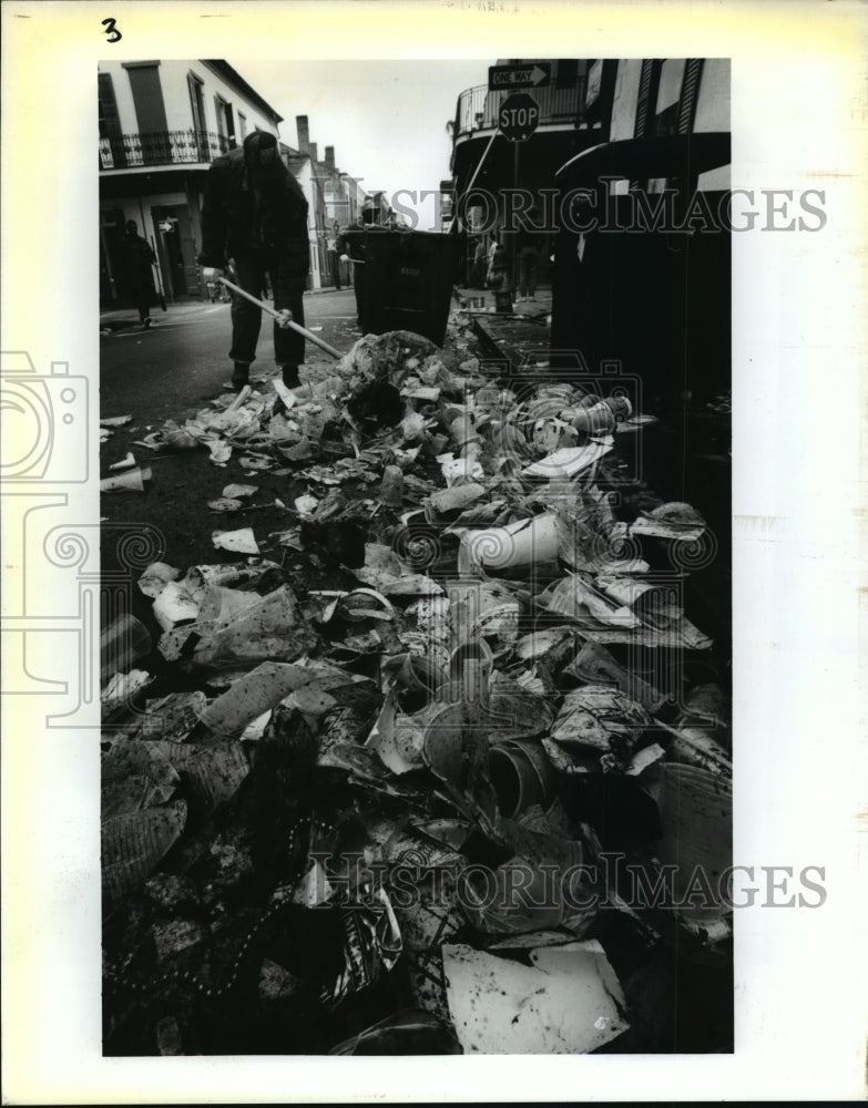 1995 Edgar Roberts Shovels Trash at French Quarter after Mardi Gras - Historic Images