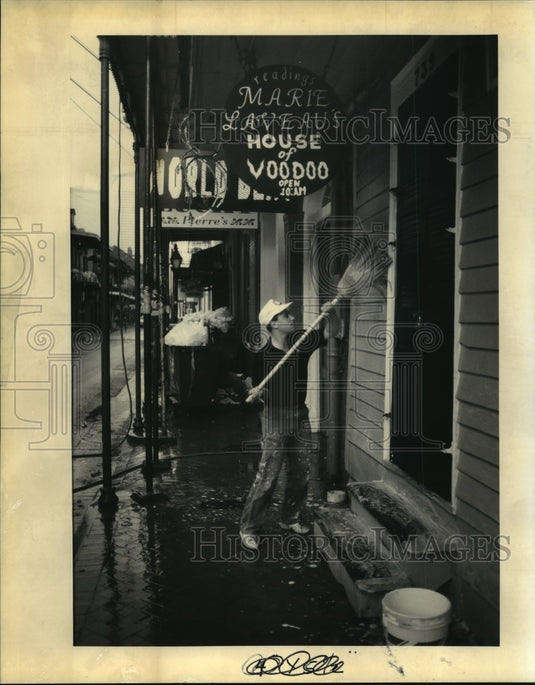 1992 Richard Wingate Washes Building & Sidewalk after Mardi Gras - Historic Images