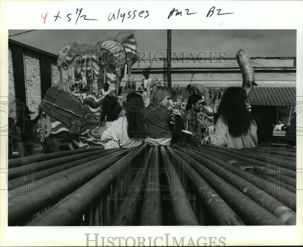 1994 Carnival Parade goers sit on idle barricades in Gretna. - Historic Images