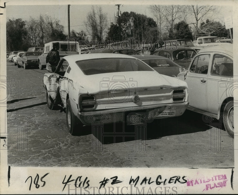 1974 cars parked illegally by Mardi Gras attendees are ticketed - Historic Images