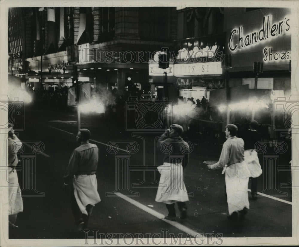 1963 Maskers Wearing White Wraps Around Waste at Mardi Gras - Historic Images