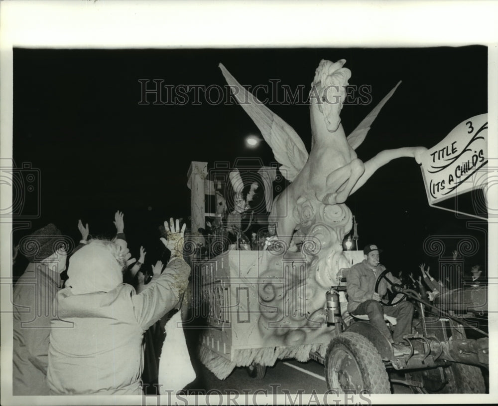 1980 Pegasus parade float rolls down street on Mardi Gras - Historic Images