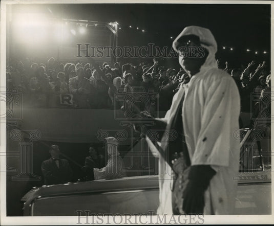 1964 Mardi Gras parade flambeaux carriers in New Orleans  - Historic Images
