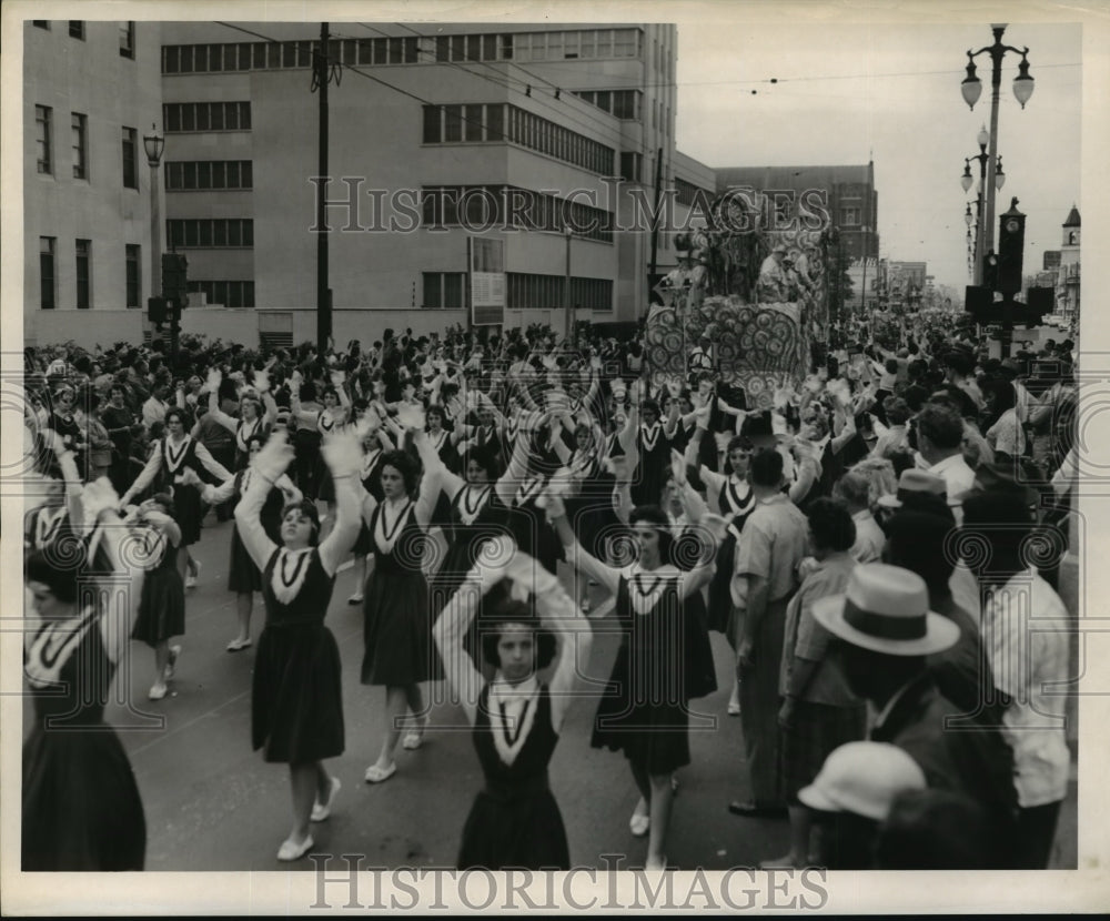 1962 Marchers in front of a float at Carrollton Parade on Mardi Gras - Historic Images