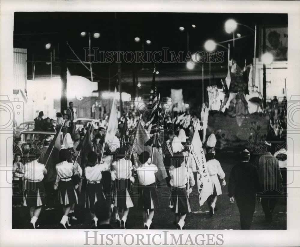 1965 Girls hold flags at Zeus parade on Mardi Gras in New Orleans - Historic Images