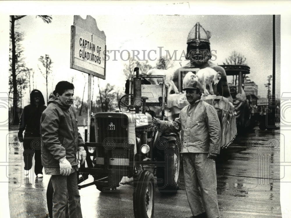 1988 Men by a Gladiator parade float on Mardi Gras  - Historic Images