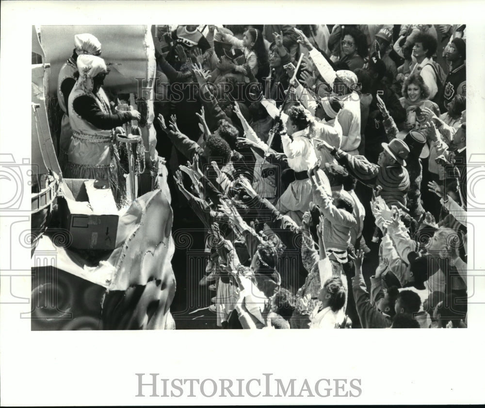 1988 Mardi Gras Goers Beg for Throws from Krewe of Zulu Parade Float - Historic Images