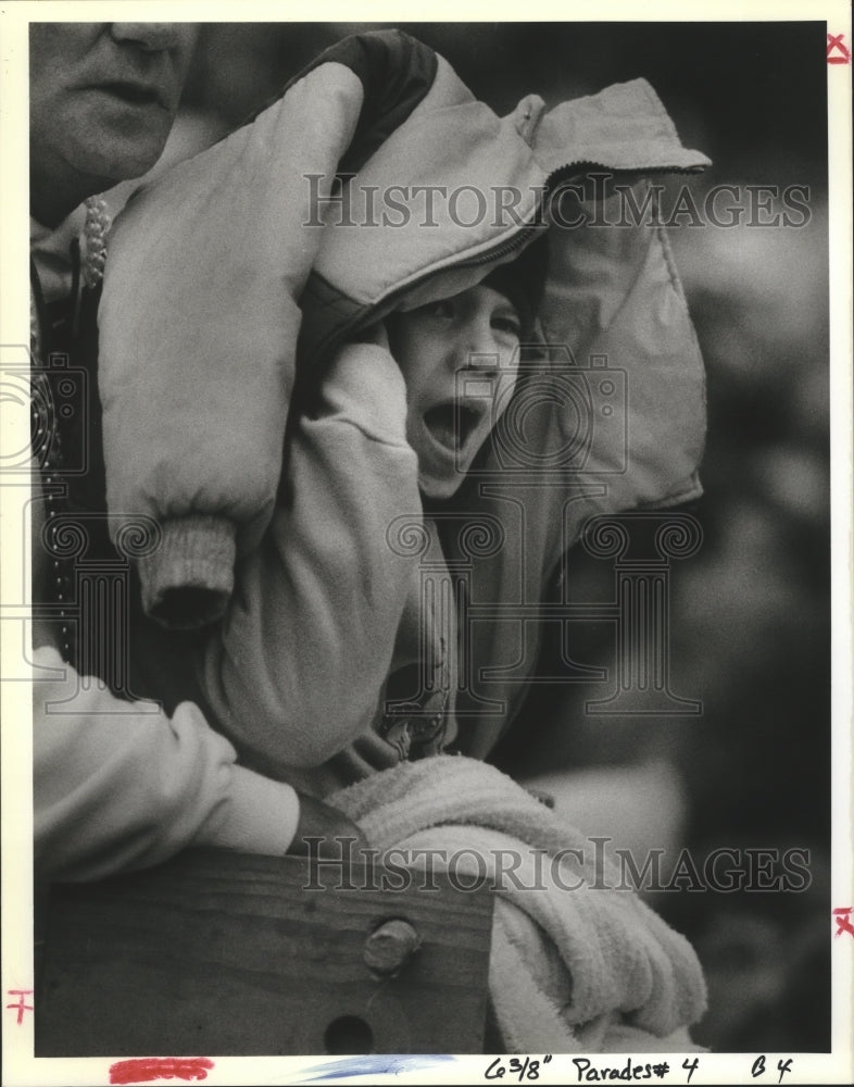 1989 Blake Trahan braves the cold at the Tucks parade on Mardi Gras - Historic Images