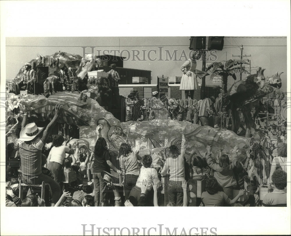 1980 Carnival Revelers Watch Parade Float with Maskers at Mardi Gras - Historic Images