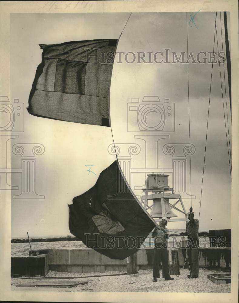 1965 Coast Guardsmen Alvin Pekinto, Therone Boyd and Hurricane Flags-Historic Images