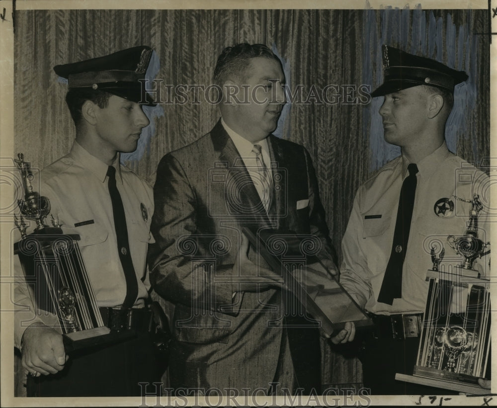 1963 Press Photo Joseph Giarrusso presents trophies to two police cadets - Historic Images