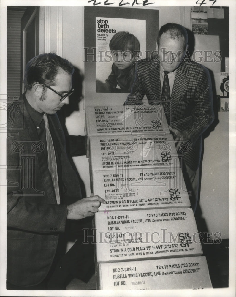 1970 Elmo Blaize &amp; Dr. Charles Caraway unload rubella vaccine - Historic Images