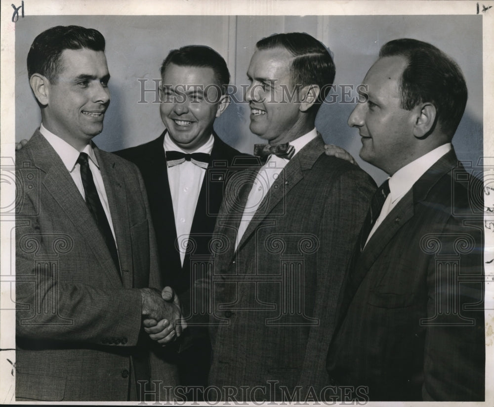 1957 Press Photo Officers elected by the Young Men&#39;s Business Club shake hands-Historic Images