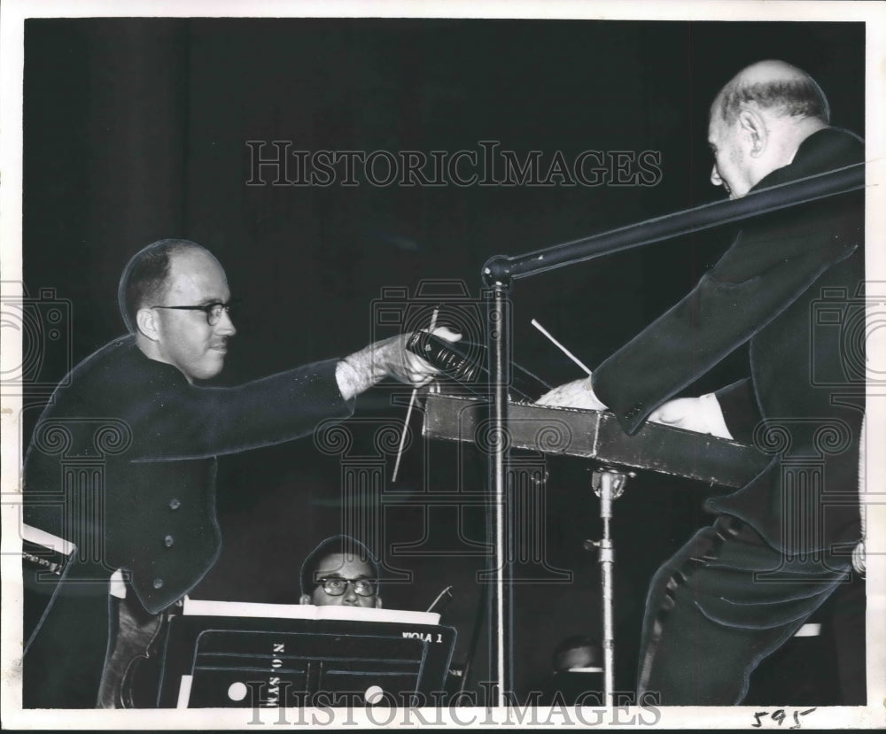 1963 Symphony Violinist hands marked score to Maestro Pablo Cassals - Historic Images