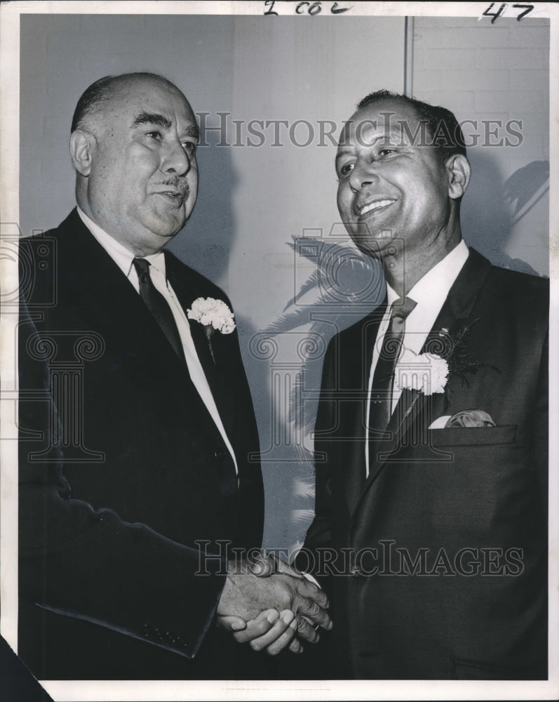 1966 C.L. Dennis & Louis Charbonnet at dinner in Fontainebleau Hotel - Historic Images