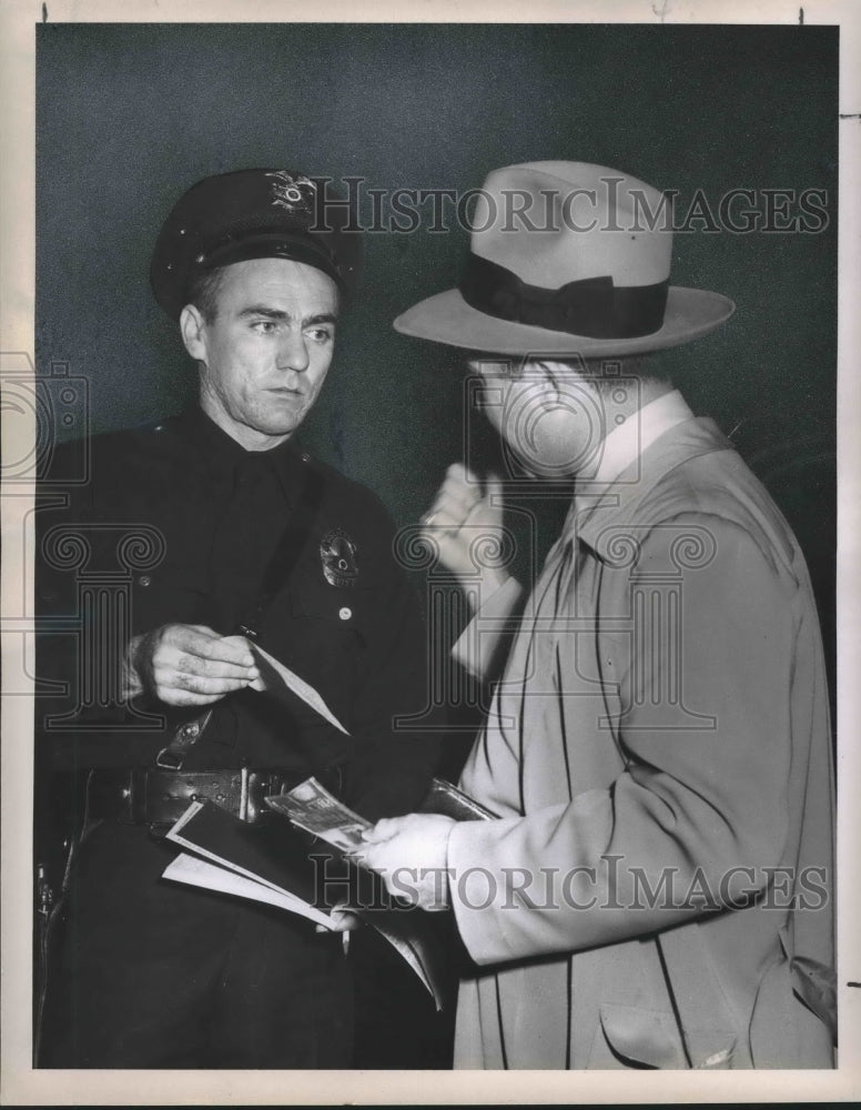 1951 A man argues, threatens a police officer after getting a ticket - Historic Images