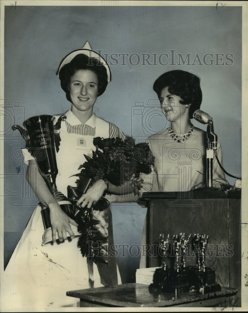 1963 &quot;Miss Mercy&quot; Mary Margaret Coulon holds a loving cup and roses - Historic Images