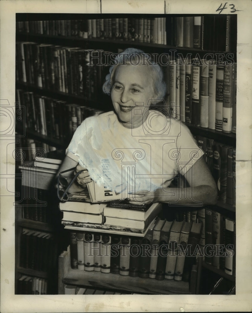 1953 Bookshop owner Tess Crager with some of her inventory - Historic Images