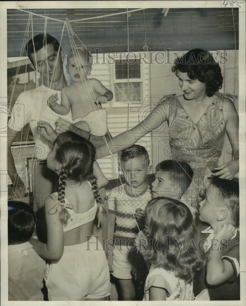 1955 Evelyn and T Costilow get Bunny&#39;s birthday party started - Historic Images