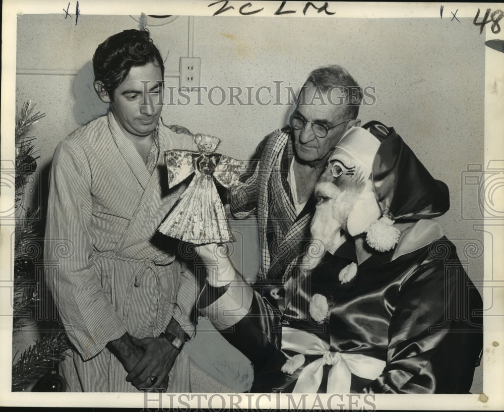 1962 Santa shows doll to patient, Charity Hospital Tuberculosis Ward-Historic Images