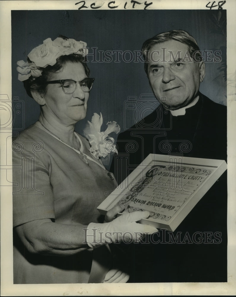 1962 Mrs. William E. Crotty receives award from Archbishop Rummel - Historic Images