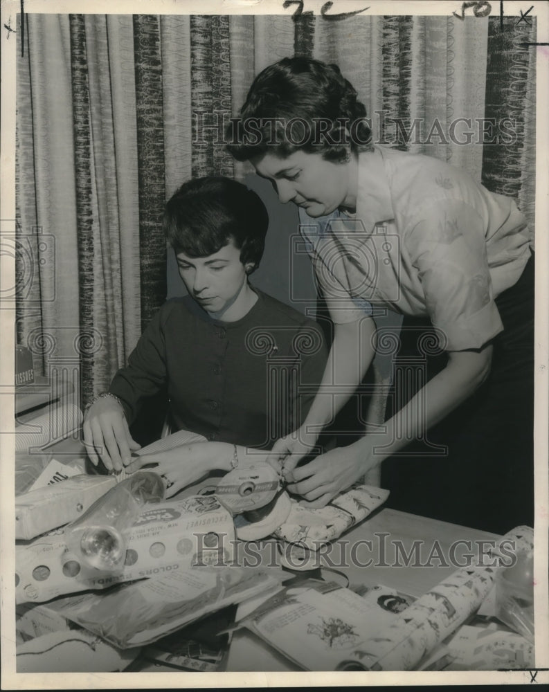 1962 Members of Zeta Tau Alpha wrap gifts for Cerebral Palsy Center - Historic Images