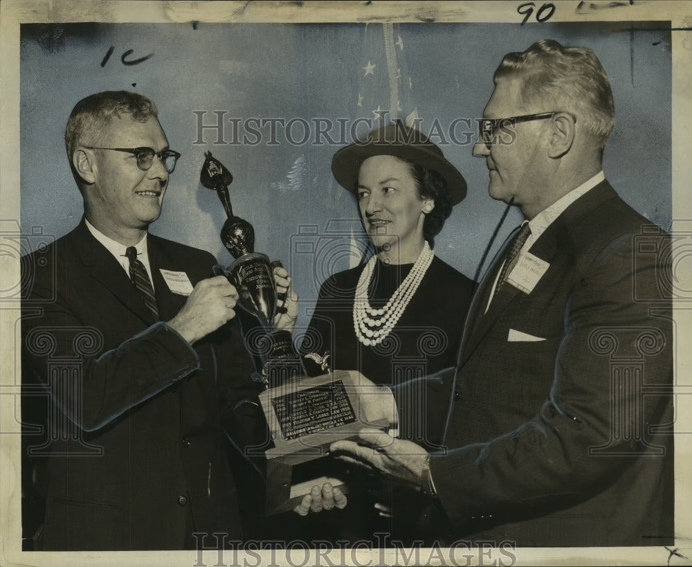 1961 Mel Duran receives trophy at Loyola alumni home-coming luncheon - Historic Images