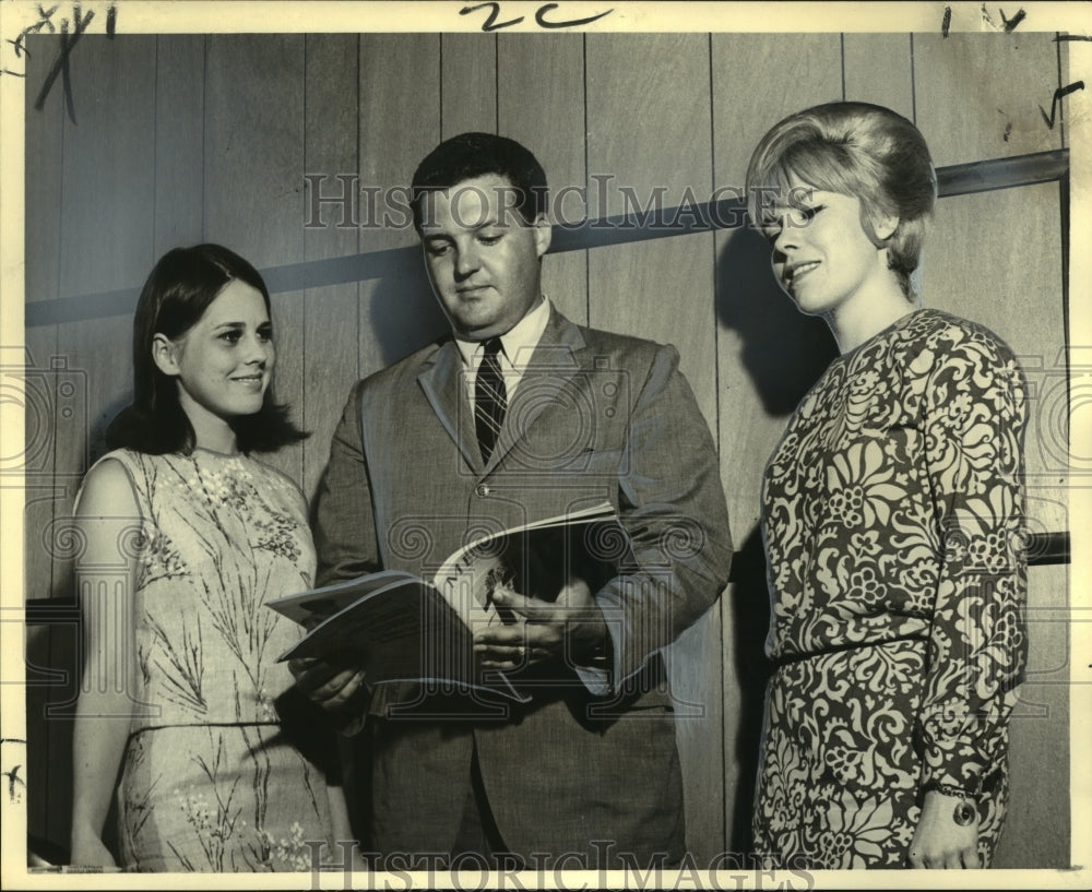 1965 David D. Duggins reviews pageant applications of two entrants - Historic Images