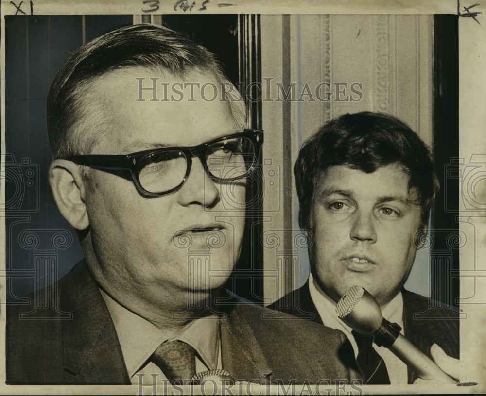 Sen. Adrian Duplantier talks to newsman while David Chandler listen - Historic Images