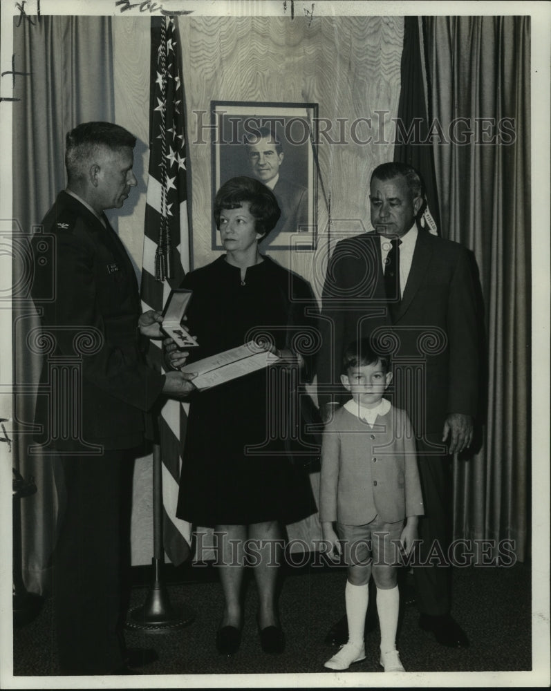 1969 Duthu family accepting Bronze Star medal for Cpl. James Hebert - Historic Images