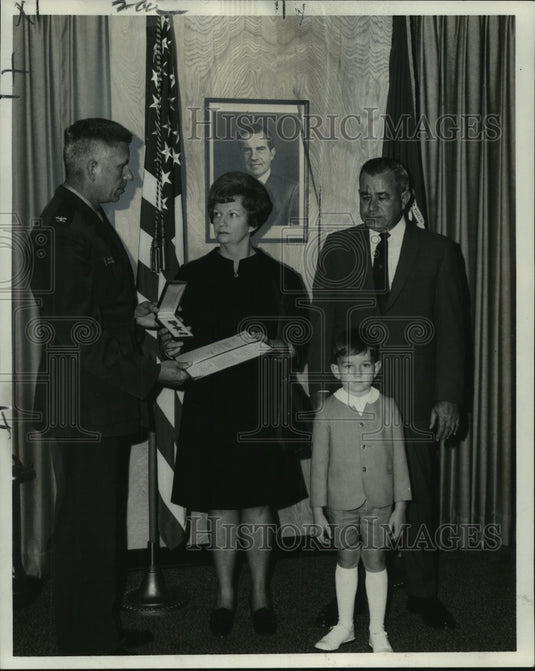 1969 Duthu family accepting Bronze Star medal for Cpl. James Hebert - Historic Images