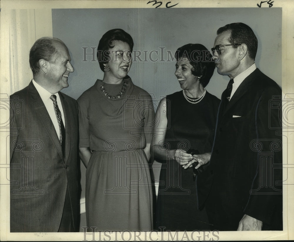 1966 Mr. and Mrs. Henri Etienne, with two others in conversation - Historic Images