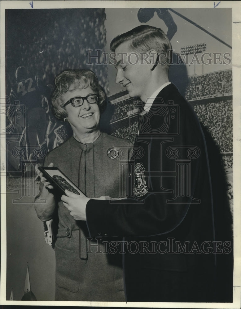 Mrs. Edna Englert, Sugar Bowl, presenting a plaque to young man-Historic Images