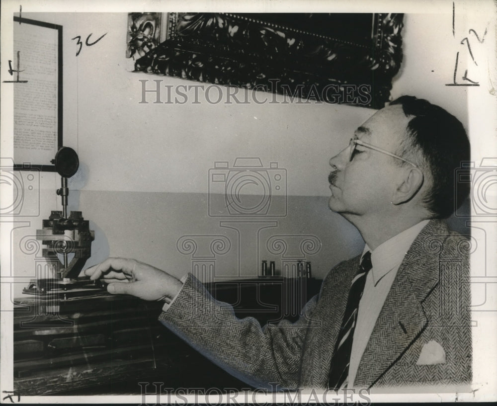 1955 Dr. G. Waldo Dunnington examines 1833 telegraphic machine - Historic Images