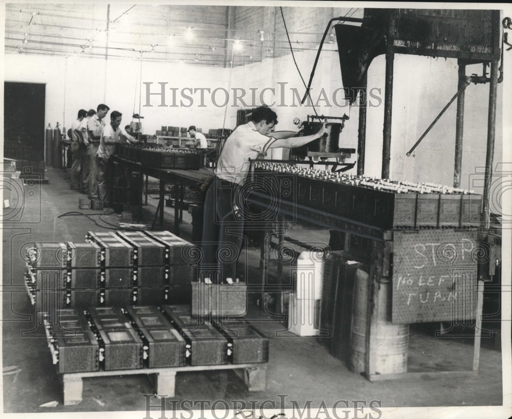 1963 Workers make auto batteries with lead imports - Historic Images