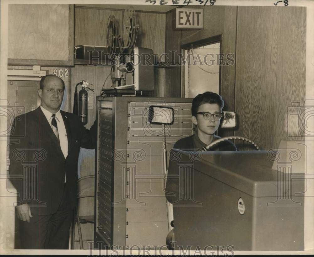 1967 Coach Donald L. Fortier runs projector in Drivers Ed Class-Historic Images