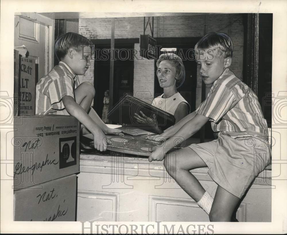 1965 Mrs. Vance Gilmer and sons move records for Book Fair-Historic Images