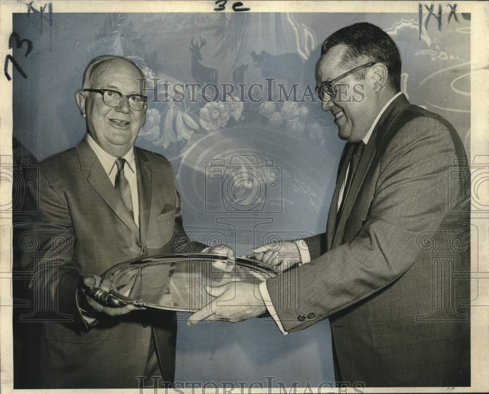 1970 Robert E. Gough receives silver tray from Arthur F. Felt Jr. - Historic Images