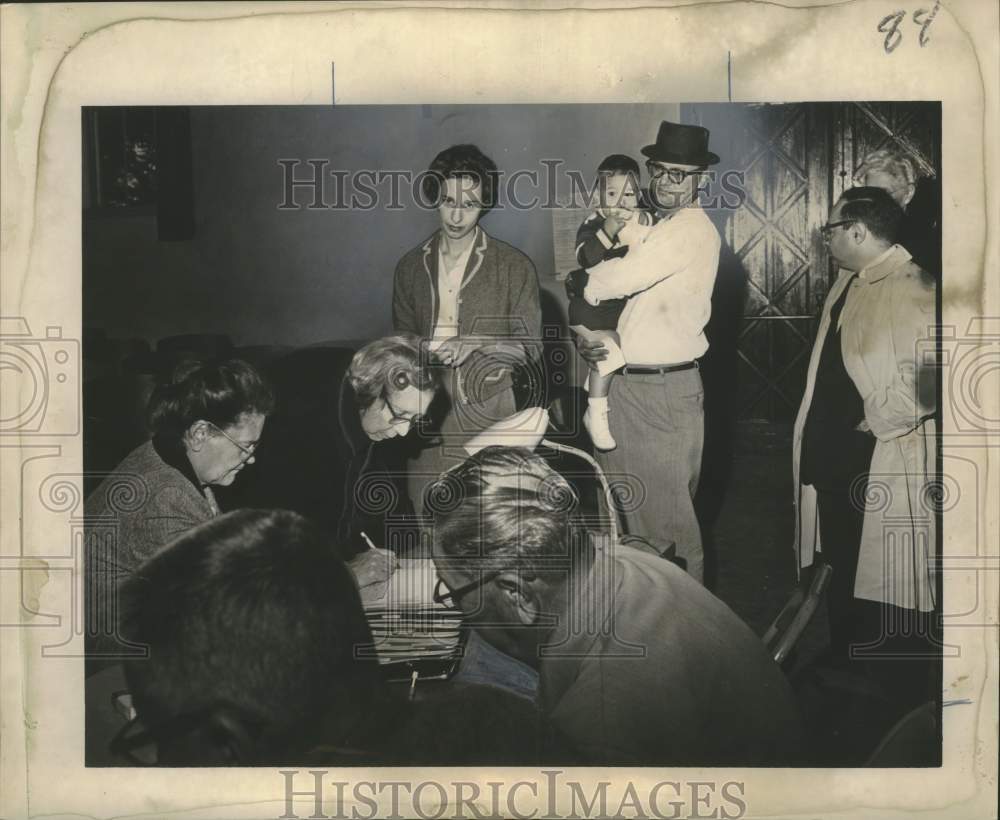 1963 Voter brings junior to poll at McMain High School New Orleans - Historic Images