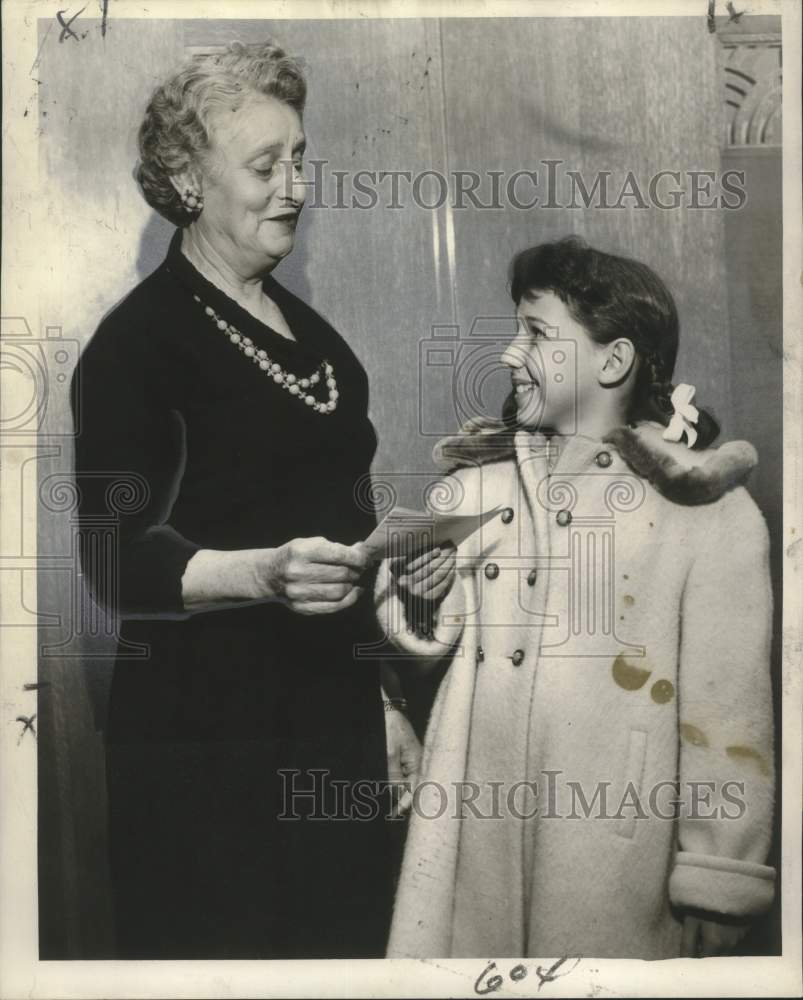 1955 Mrs. Emma Heitcamp presents $150 to Sue Dupuy-Historic Images