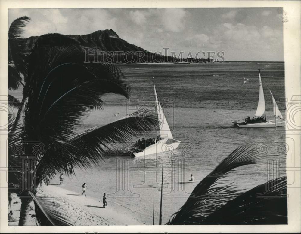 1961 Couple of catamarans sail away from Waikiki Beach in Honolulu-Historic Images