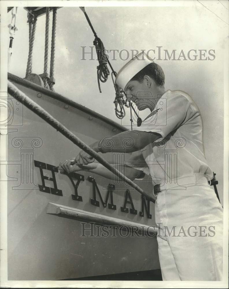 1969 Seaman removes letters from whaleboat before it leaves Navy-Historic Images