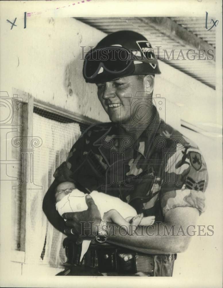 1967 Press Photo Air Force Tech Sergeant Holding Newborn Vietnamese Baby - Historic Images