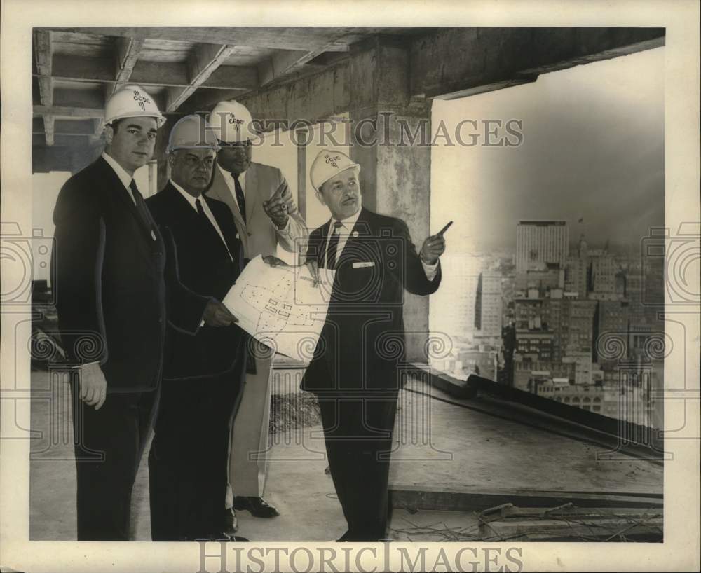 1965 City Officials check progress of International Trade building - Historic Images