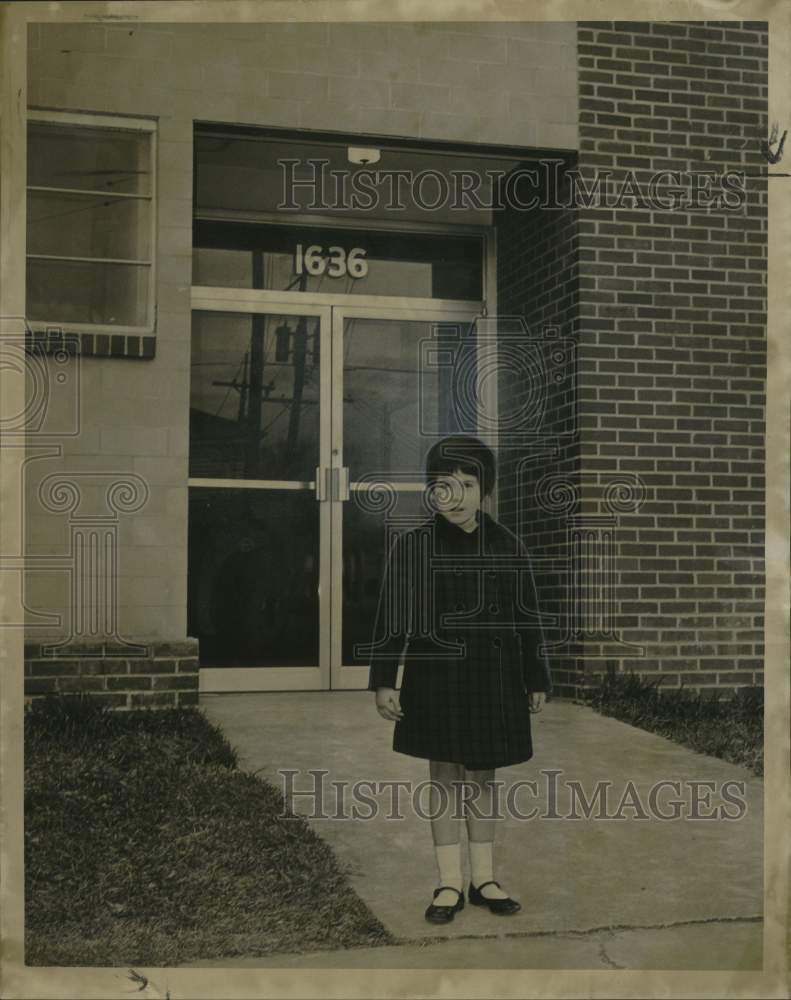 1967 Susan Kohlmeyer stands in front of the David Baird building - Historic Images