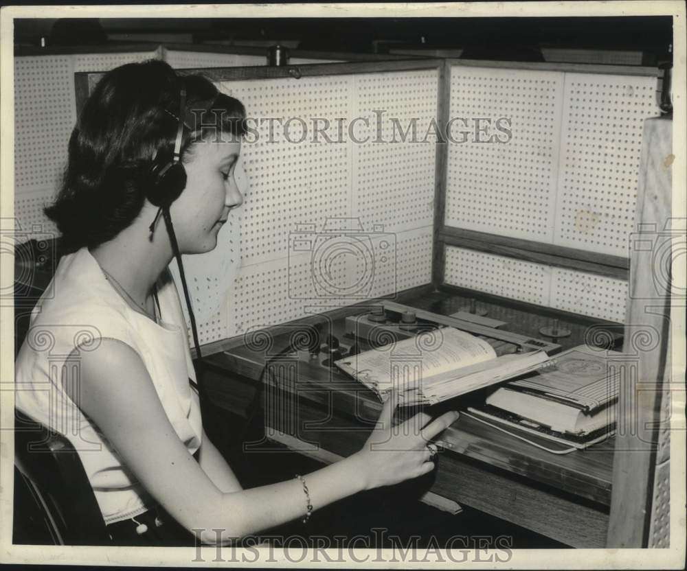 1960 Frances Wheeler listens to tape and follows the lesson-Historic Images