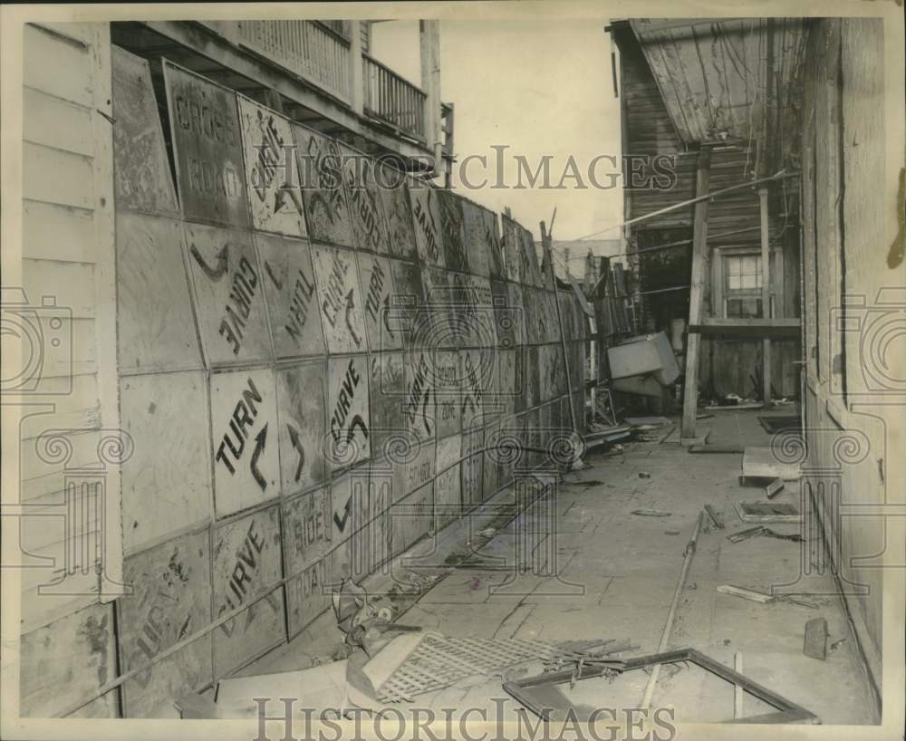 1964 104 Signs make up the fence in alley in New Orleans-Historic Images